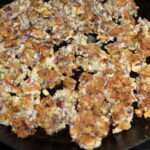 Sautéing the tofu vegetable mixture in skillet until golden.