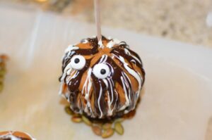 chocolate caramel apples decorated with googly eyes