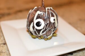 chocolate caramel apples decorated with googly eyes