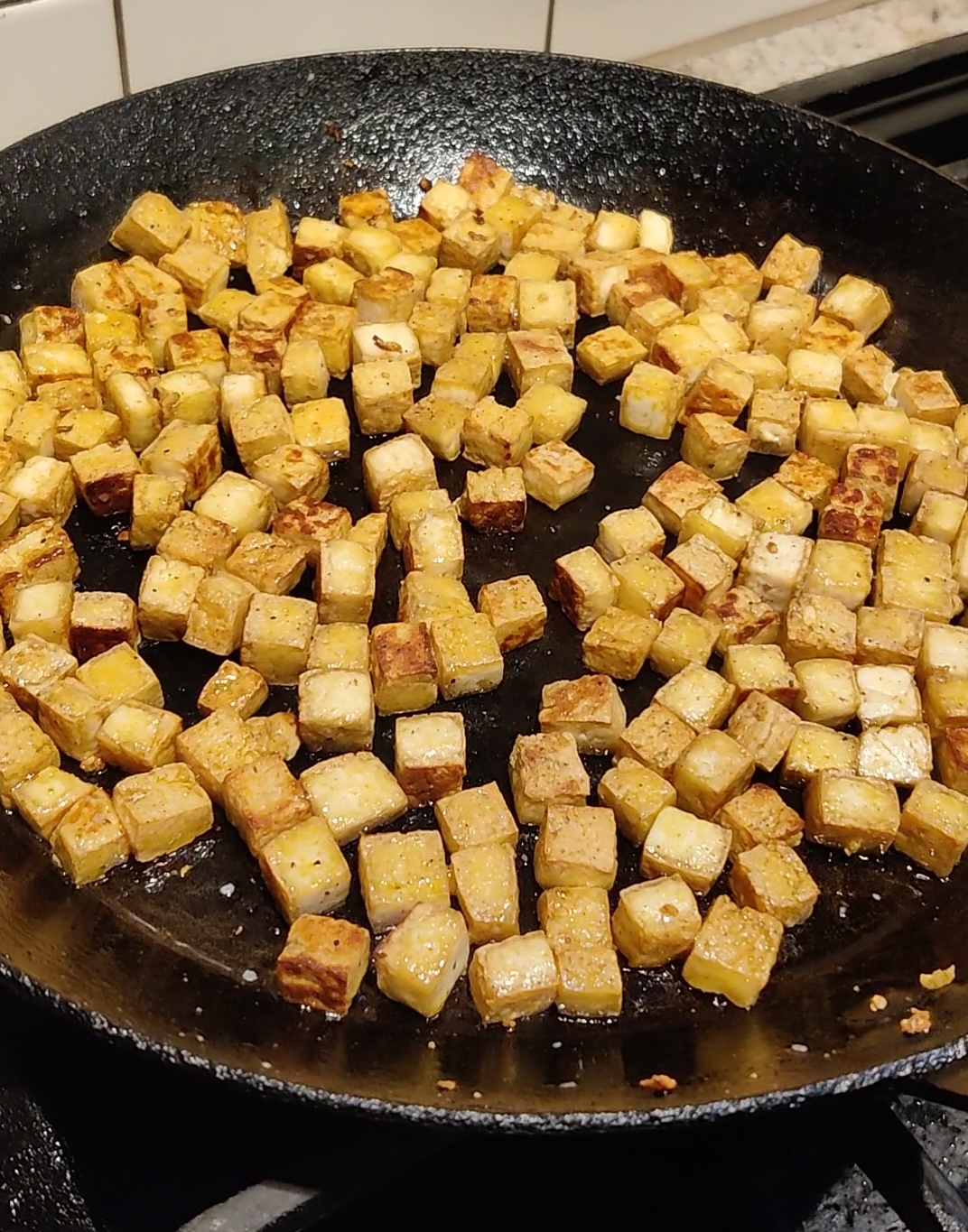 Tofu cubes sautéed until golden brown.