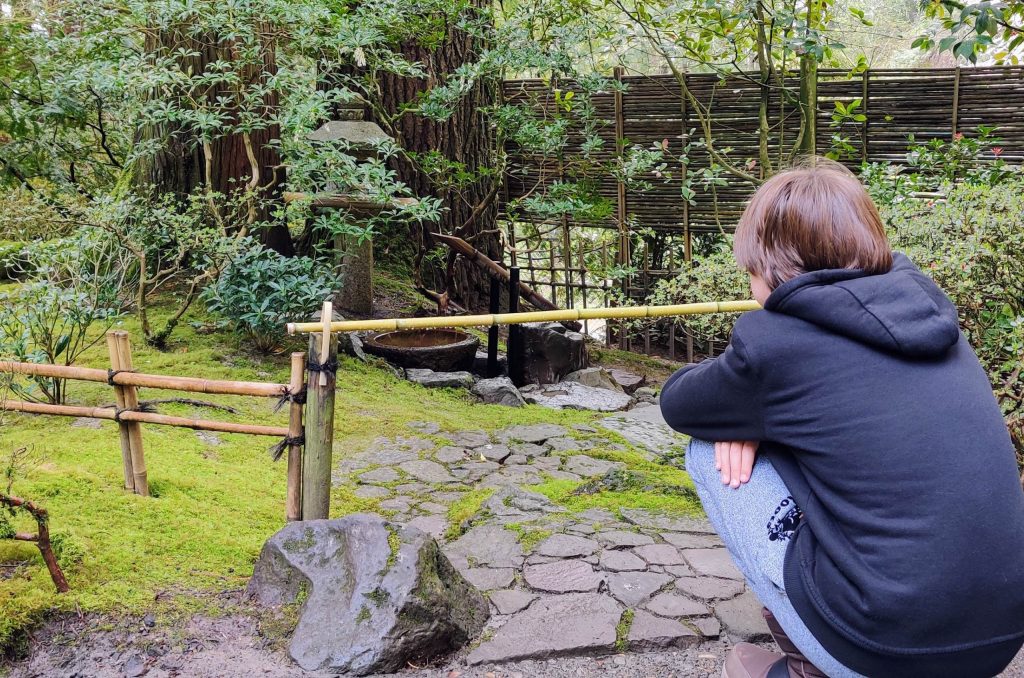 Image of a kid in a calm quiet space outdoors. 