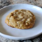 Crispy chewy coconut cookie on a plate