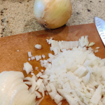 diced onions on a cutting board