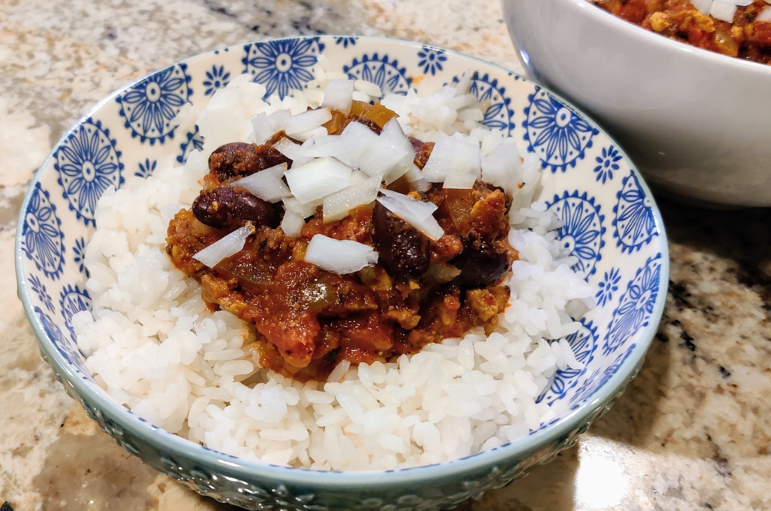 Hawaiian chili and rice with diced onions